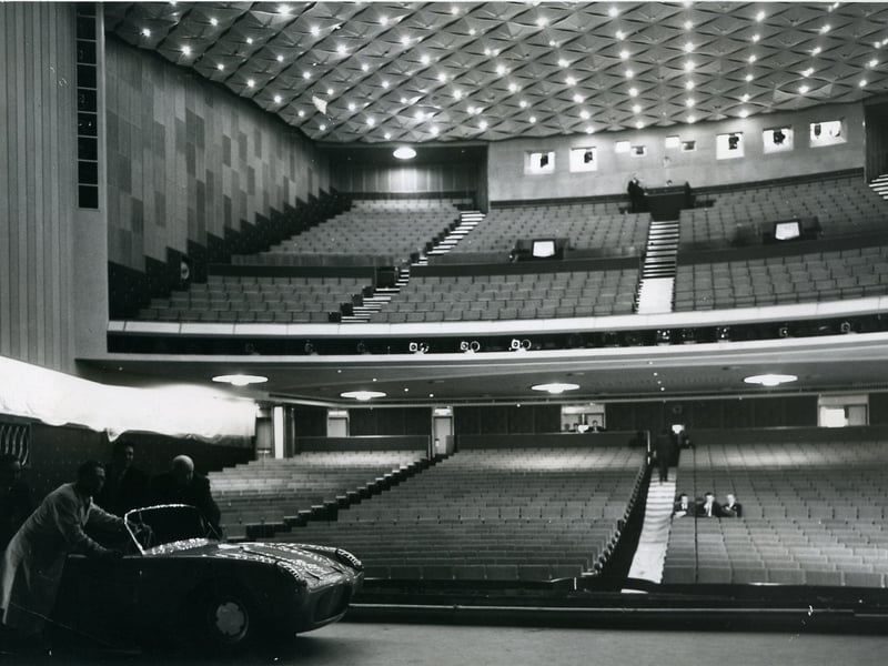 A sports car pushed onto the stage of the new ABC Theatregives an idea of the size of the interior of the building, 1963