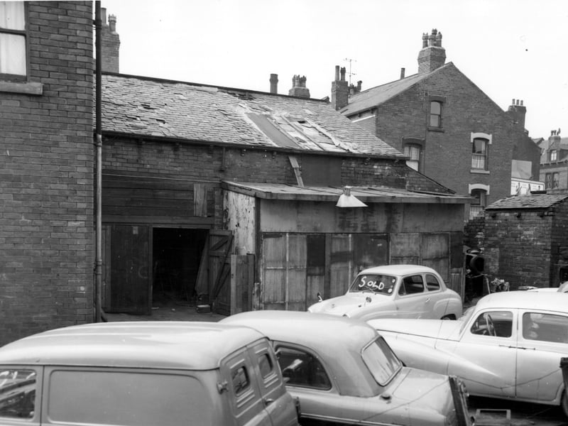 Garages and a yard to the rear of number 8 Ebenezer Place. Number 8, just seen on the left edge was the home of Peter Kelly, a motor engineer. It is likely that he is also using the yard to sell the cars visible in the foreground. Pictured in May 1965.