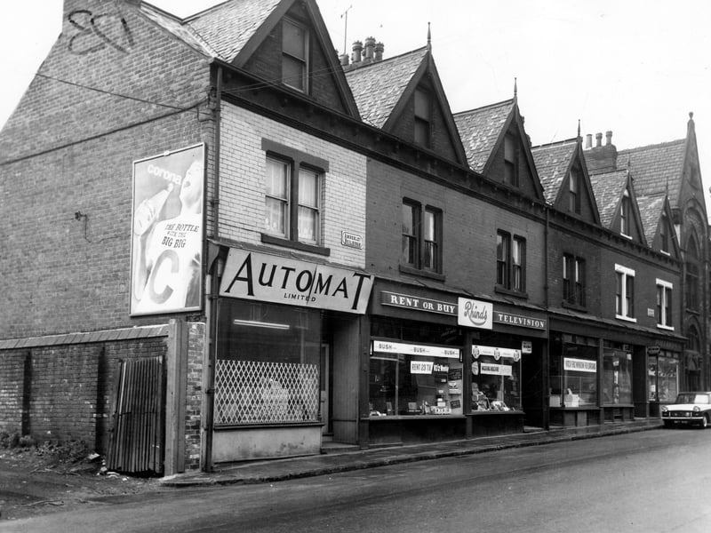 Located between numbers 97 and 97a Tong Road, these were the Amberley Buildings, a row of commercial properties which went through to residential buildings on Florence Street. Pictured in May 1965.