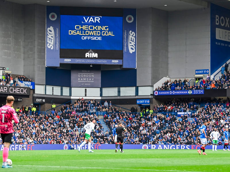 Fans await Tom Lawrence's goal being awarded by VAR.