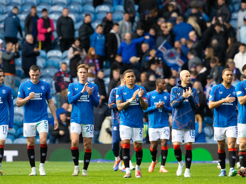 The Rangers players applaud the Ibrox crowd.