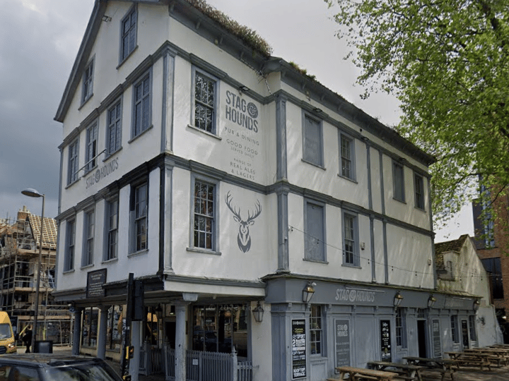 The pub dates back to the 15th century and was originally used as a court of pie powder (a court held at markets to deal with disputes between traders and customers). There are legends that a room upstairs was used as a hanging room where those sentenced to death were hanged. Paranormal activity has been rumoured to have taken place in the building throughout the years, including sudden drops in temperature, particularly in certain parts of the building, such as the upper floors, disembodied footsteps and the sound of faint voices have been heard, especially at night when the pub is quiet and several people have claimed to see ghostly figures, including a man who appears to be dressed in period clothing. There have also been reports of objects being moved or knocked over without explanation, and some staff members have recounted eerie experiences where things would disappear only to reappear later in different locations. The most frequent sighting is the Grey Lady, a spectral figure dressed in grey who haunts the upper floors of the pub and has been spotted standing at the top of the stairs or moving silently through the building.