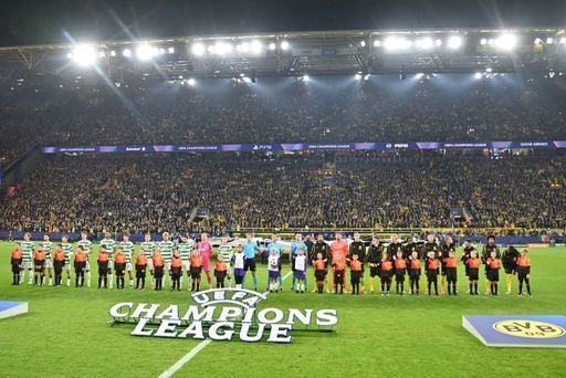 Both teams line up during the UEFA Champions League anthem.