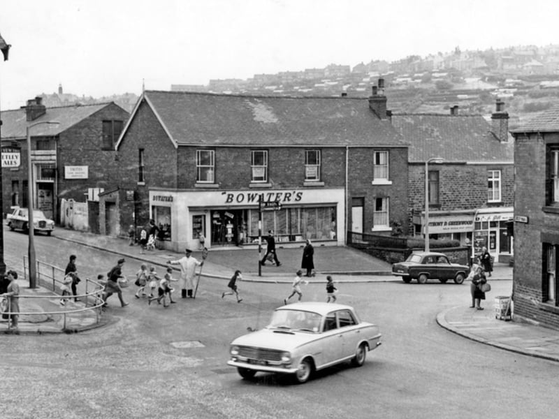 There weren't quite as many cars around back in the 60s but there were still lollipop people to help children across the road, like this one pictured on Loxley Road, Malin Bridge, in July 1964