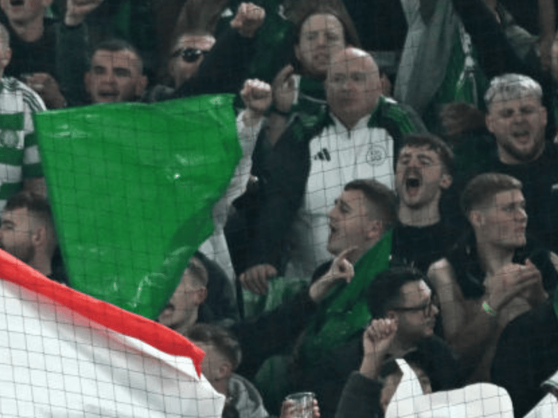 Celtic fans back the team from the Signal Iduna Park away end.