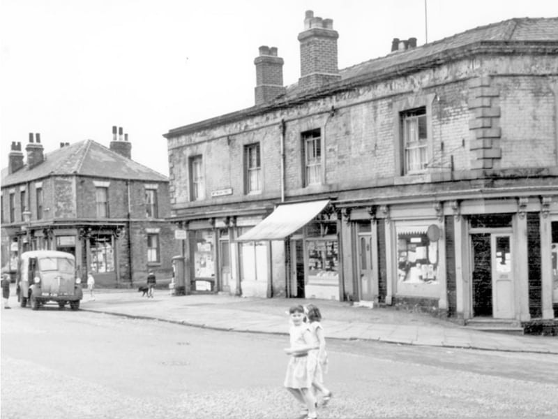 Shops were different back then. Pictured are youngsters in front of a row of shops on Nottingham Street, Pitsmoor, at the junctions with Fitzalan Street and Andover Street, in June 1965