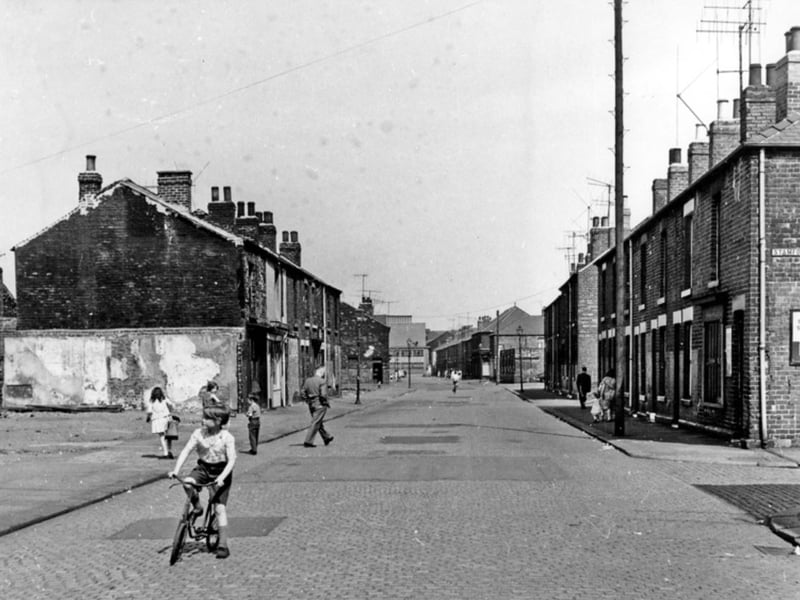 Children were free to play on the streets back then. Pictured is a youngster on his bike on Alfred Road, at the junction with Stamford Street, looking towards English Steel Corporation, in 1966