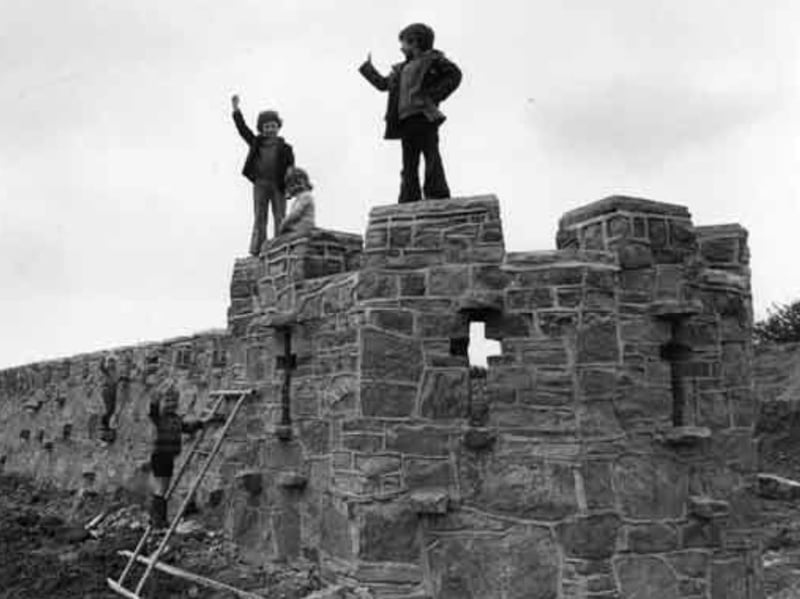 Children in the castle play area overlooking Westfield Township at Mosborough, Sheffield, in May 1975