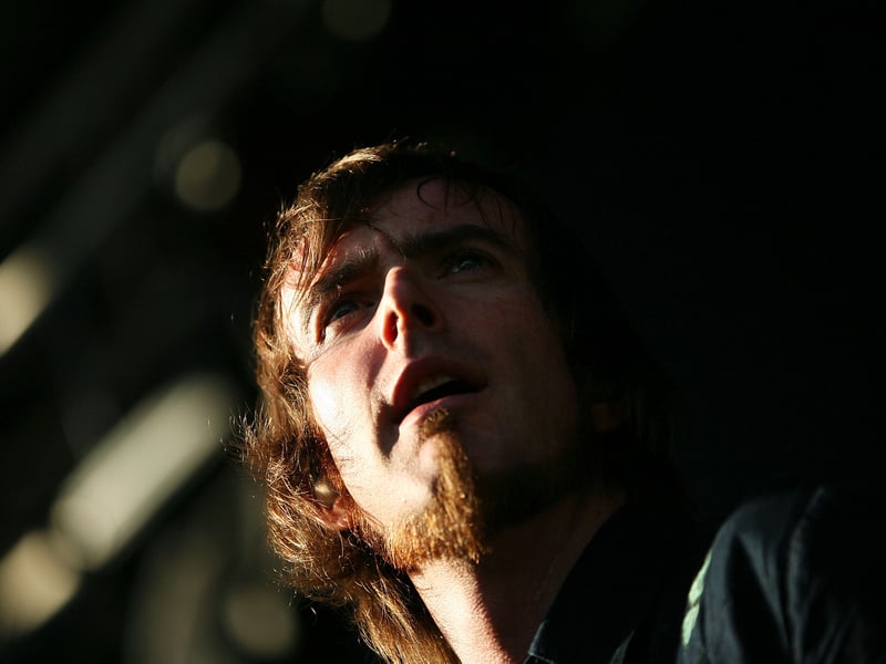 Karnivool is an Australian progressive rock band that blends intricate rhythms and expansive soundscapes. Known for albums like Sound Awake and Asymmetry, their music is marked by complex time signatures, atmospheric layers, and emotionally charged vocals from Ian Kenny (pictured).