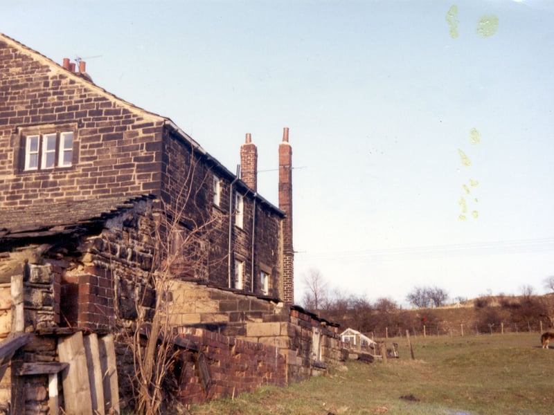 Stank Hall on Dewsbury Road in 1983. This farmhouse dates back to at least 1609 when it was purchased by Christopher Hodgson, though it is part of a farm that is much older, with a barn built possibly as far back as 1448 (from tree-ring dating). Some elements of an earlier timber-framed building which may date from the same time still survive in the brick walls of the Hall. Now a listed building, it was still in use as a farmhouse until the 1960s.