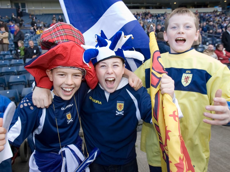 Young fans celebrate the famous 1-0 win over star studded France at Hampden in 2006.
