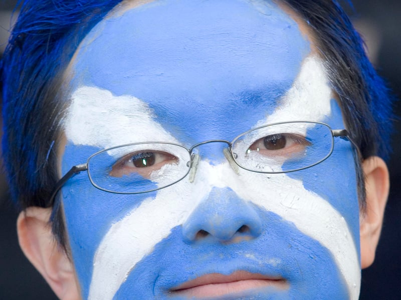 One Scotland supporter dons the saltire face paint at Hampden.