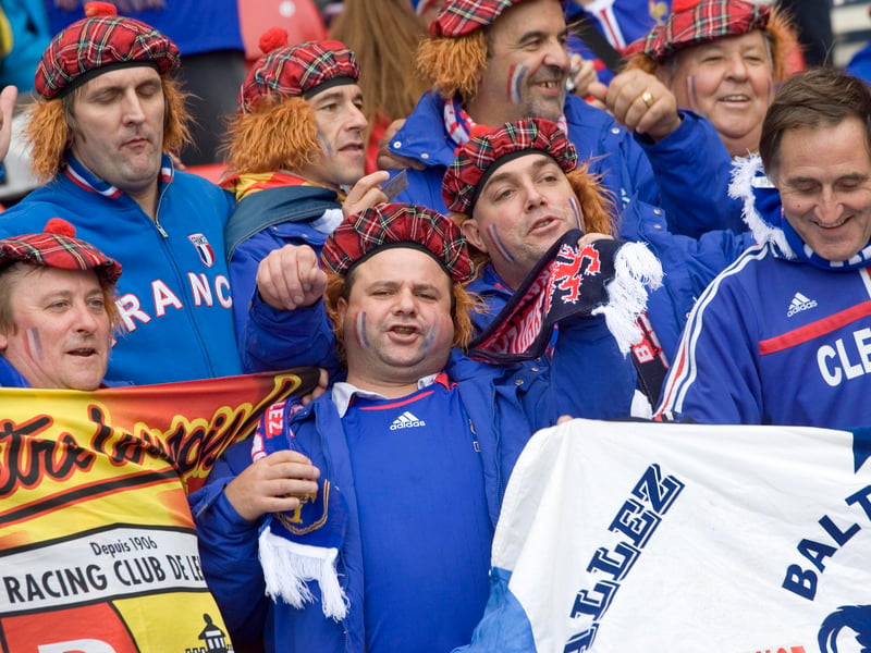 The away end dons Tartan hats and wigs ahead of the game between Scotland and France in 2006.