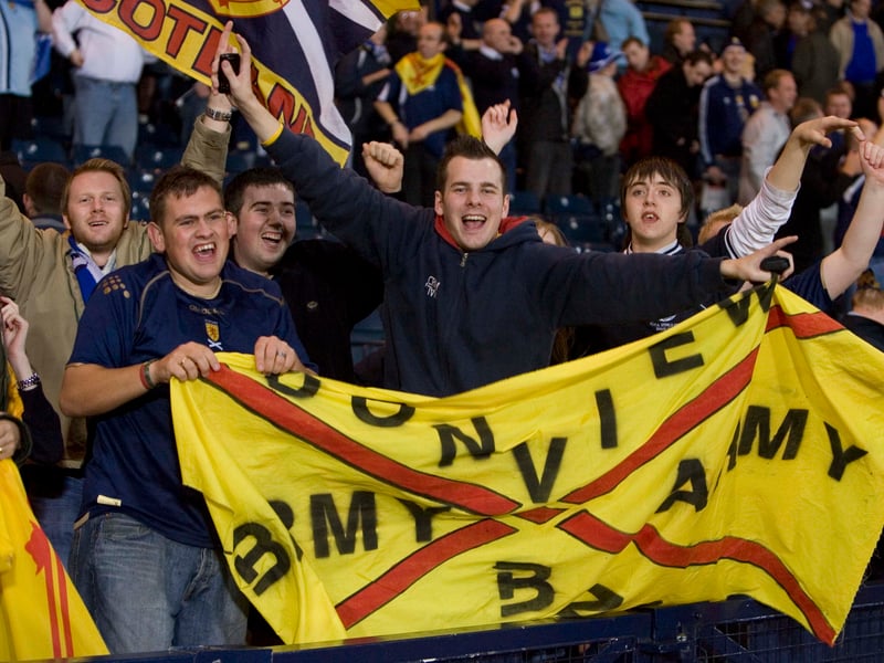 Scotland fans celebrate the result.