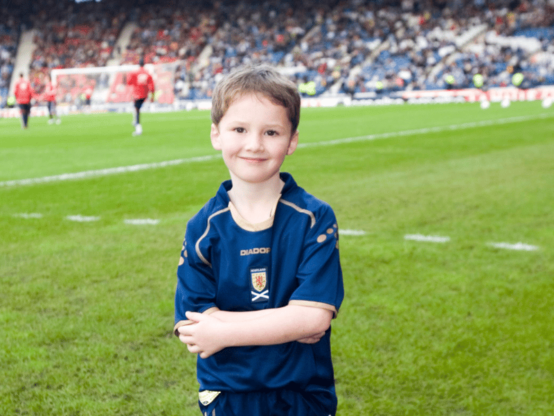 The young Scotland mascot poses for a photo ahead of kick-off.