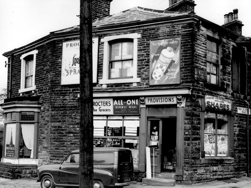 Number 182 Stanningley Road is the house on the left with the bay window. A notice has the name Ken Whitaker, central heating and bathroom conversions. Next 180 which is the business of James W. Proctor. It is a grocers and general store, goods advertised include Spratt's dog food. Pictured in April 1964.