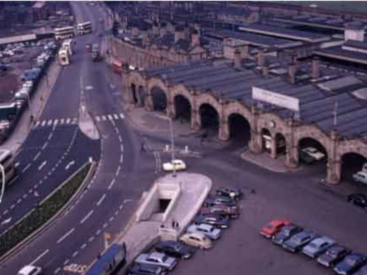 Sheffield Midland railway station, showing cars parked outside and the new pedestrian subway