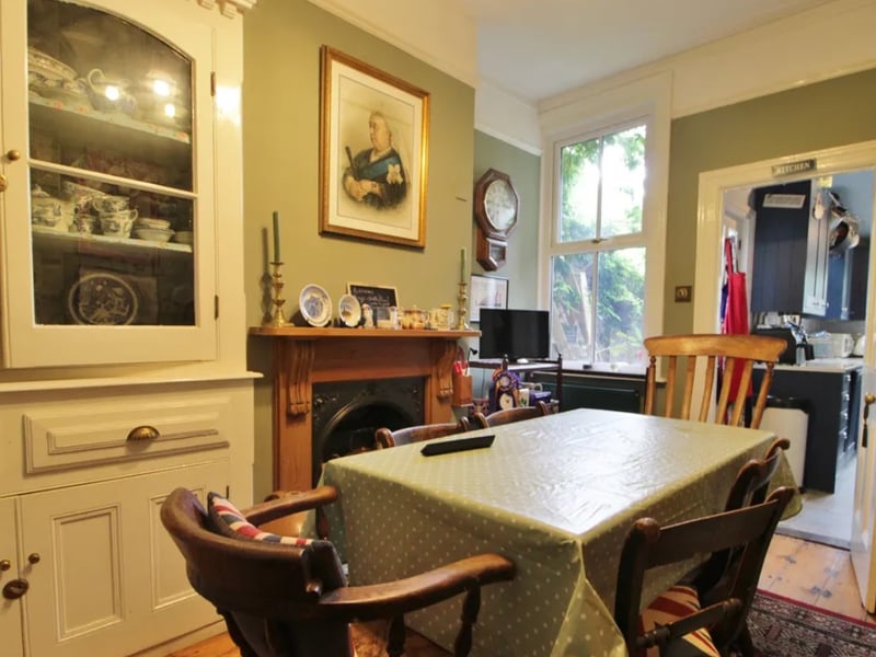 The listing says: " Featuring a double bay and forecourt, the property is rich with original details such as fireplaces, exposed floorboards, tiled flooring, ceiling roses, and double glazed sash windows."