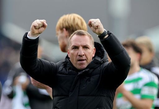 Celtic manager Brendan Rodgers celebrates with the fans at full-time.