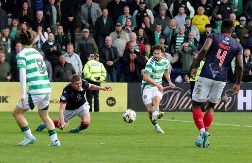 Fans prepare to celebrate as Nicolas Kuhn scores their side's winning goal at Dingwall.