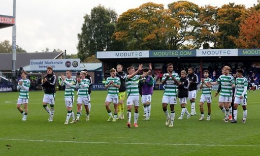 The Celtic players acknowledge the fans at the full time whistle.