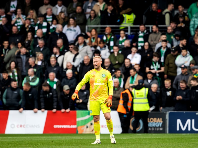 Travelling Celtic supporters watch on behind goalkeeper Kasper Schmeichel.