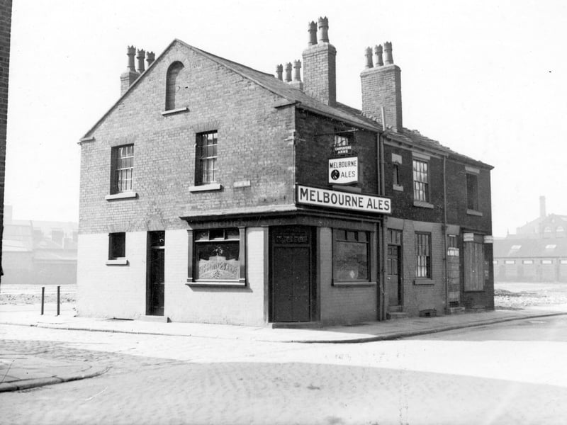 Carpenters Arms on Front Row pictured in September 1938. View shows the Front Row and Stone Row sides of the public house amid recent housing clearance. There is a clear view of the Melbourne Ales sign and window engraved with the words Carpenters Arms.