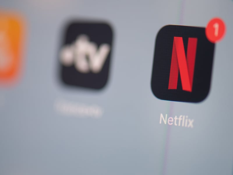 You don’t need a TV licence if you are just using your TV, laptop, phone or tablet to watch shows on the uber popular streamer Netflix. So you can binge til your heart’s content - the only exception is if you watch a live event, a TV licence is needed for that. Photo: MARTIN BUREAU/AFP via Getty Images