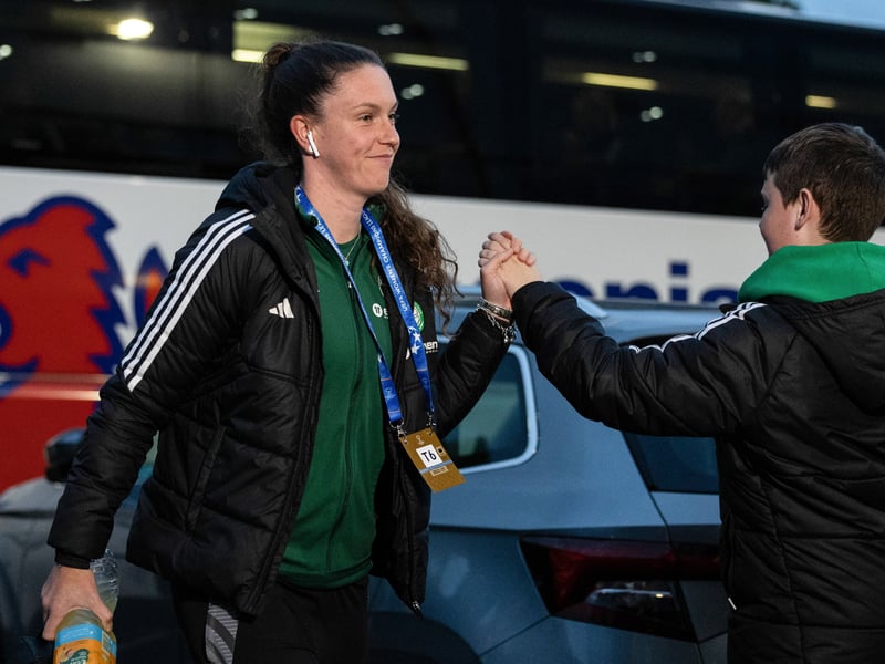 Celtic captain Kelly Clark shares a high-five with a young fan as she enters the stadium.