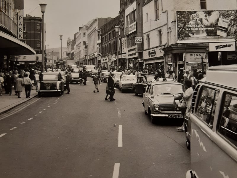 The town centre was blocked by traffic according to caption on the back of this 1972 photo. The Grand Theatre's domed roof can be seen clearly in the background
