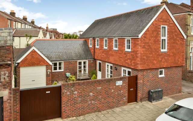 The listing says: "A unique opportunity to acquire a detached Coach House that was built in 1995 to a bespoke architectural design, the L shaped accommodation is arranged over two floors, providing 1403 sq ft of living space over two floors."