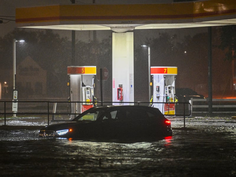 A vehicule is stranded on a water-flooded street in Brandon, Florida.