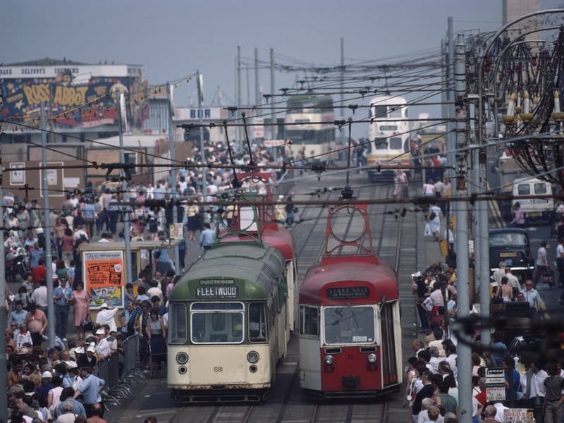 Trams and holidaymakers on the seafront of the seaside resort of Blackpool, Lancashire, August 1983