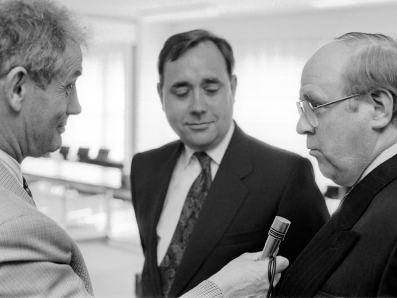 The SNP's Alex Salmond listens as shadow Scottish secretary Tom Clarke is interviewed in August 1993