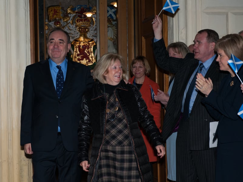 Alex Salmond departs the Scottish Parliament following his resignation as First Minister in 2014. Mr Salmond, accompanied by his wife Moira, is clapped out by colleagues, including his successor Nicola Sturgeon. Picture: Andy O'Brien