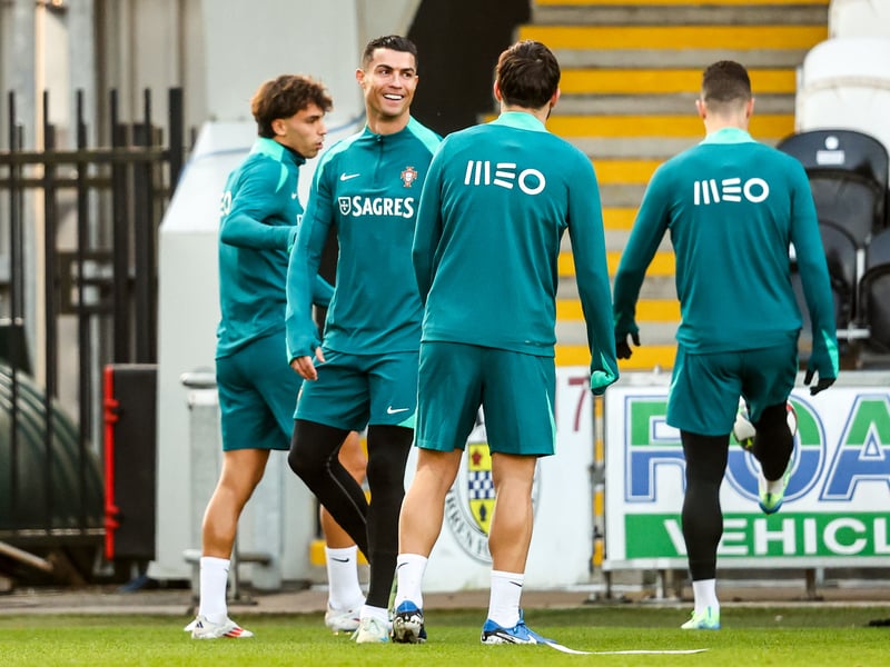 Cristiano Ronaldo shares a laugh with his Portugal teammates during the training session at St Mirren.