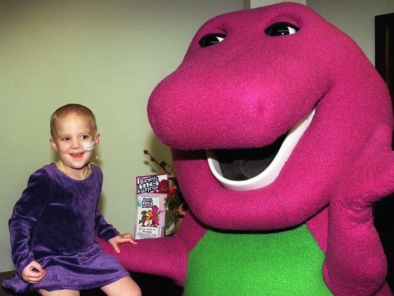 Jessica Clayton with Barney the Dinosaur at the Meadowhall lights switch-on event in 1998