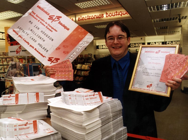 Ian Hodgson receiving his loyalty prize at the Electronics Boutique shop at Meadowhall.