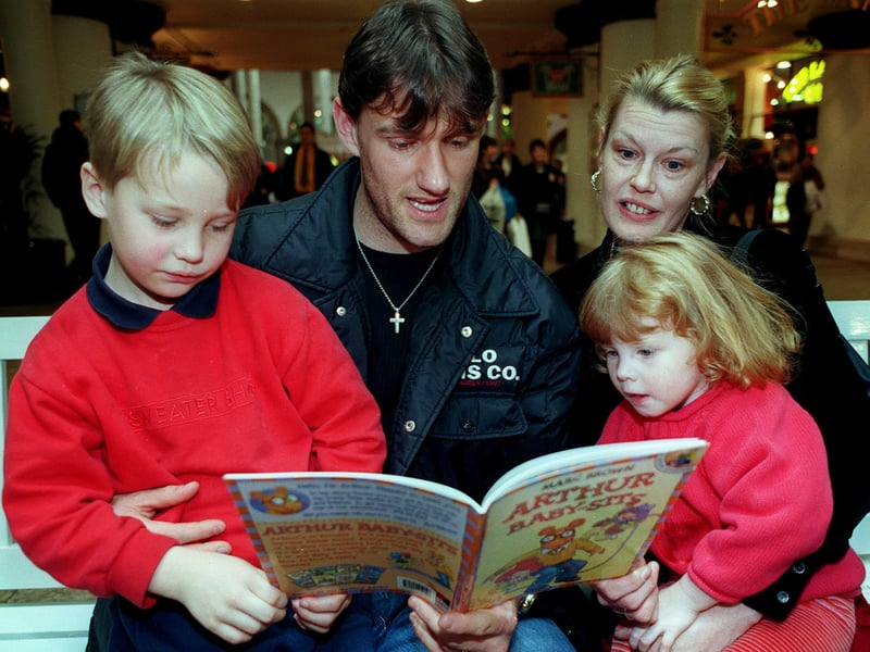 Sheffield Wednesday star Andy Hinchcliffe gets involved at the Sheffield reading roadshow at Meadowhall. With him here are the Fergusson family, mum Frances, Thomas, aged 6, and Emily, aged 2