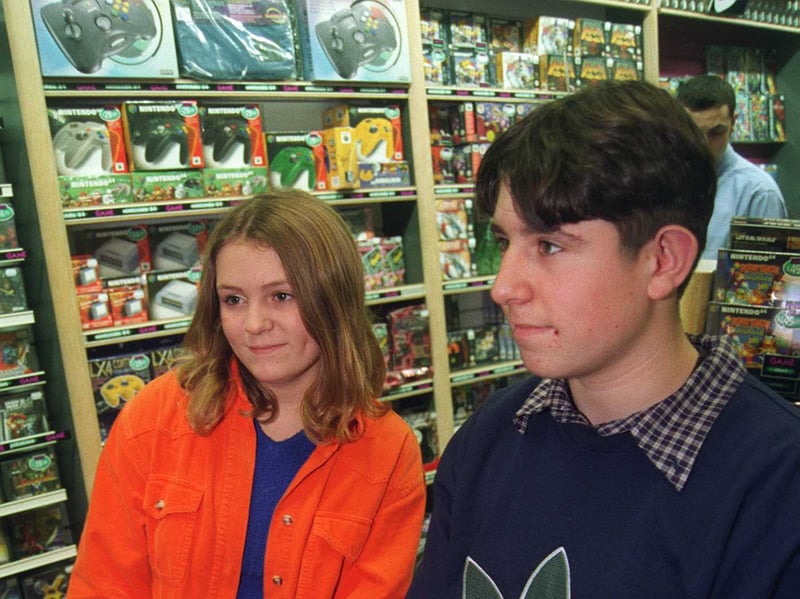 Annie Neale 13 and David Walker playing the games at Game store, Meadowhall