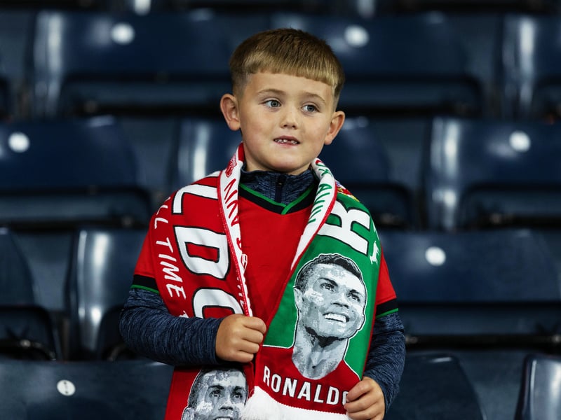 A young fan shows his support for Cristiano Ronaldo at Hampden Park.