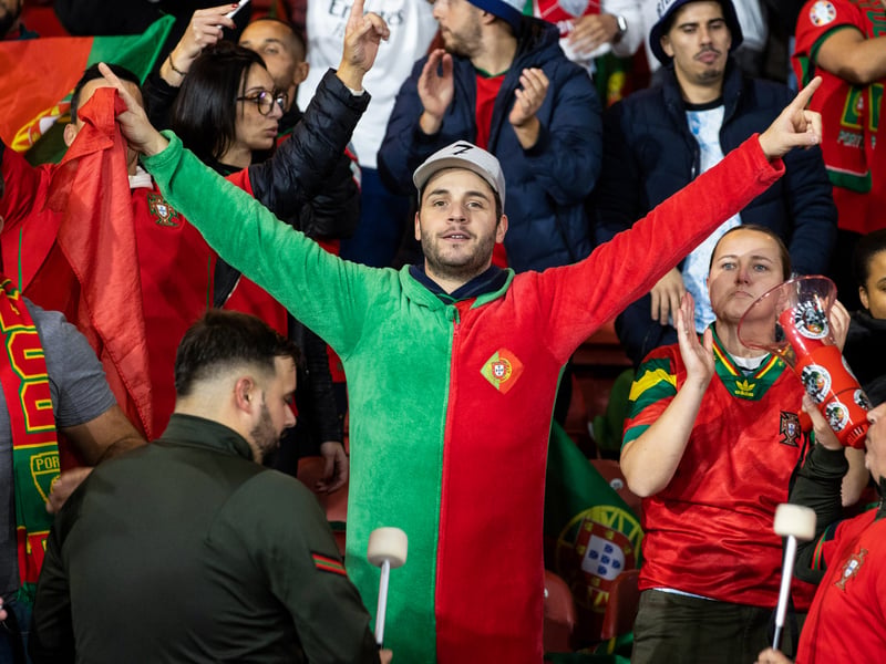 Portugal fans take in the Hampden atmosphere.