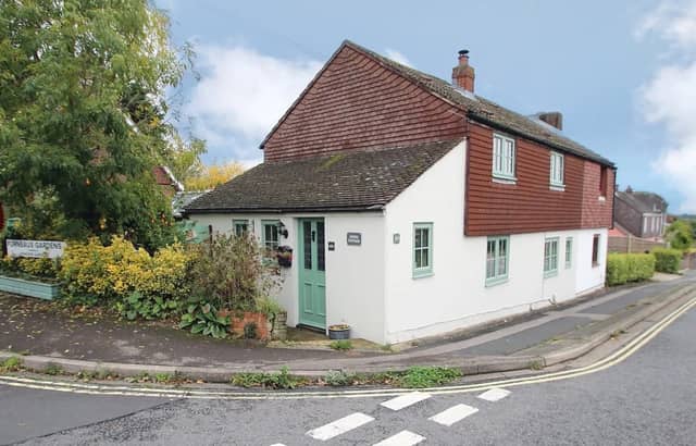 The listing says: "This delightful, extended semi-detached cottage is situated in a sought-after location, just north of Fareham town centre."