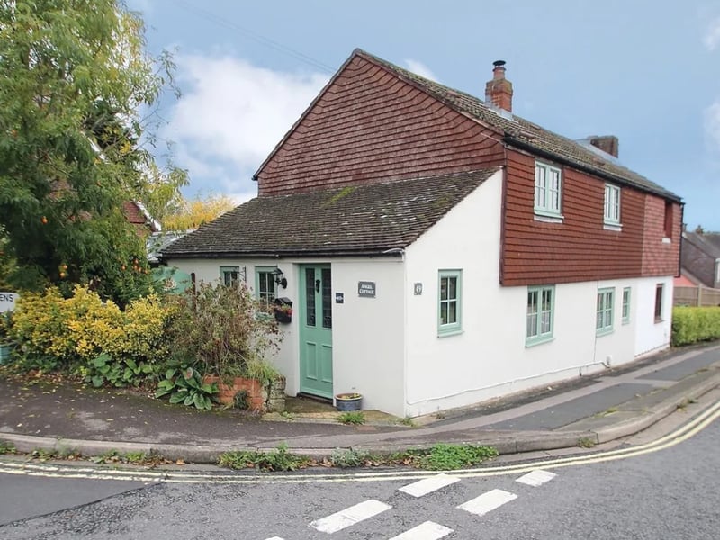 The listing says: "This delightful, extended semi-detached cottage is situated in a sought-after location, just north of Fareham town centre." 