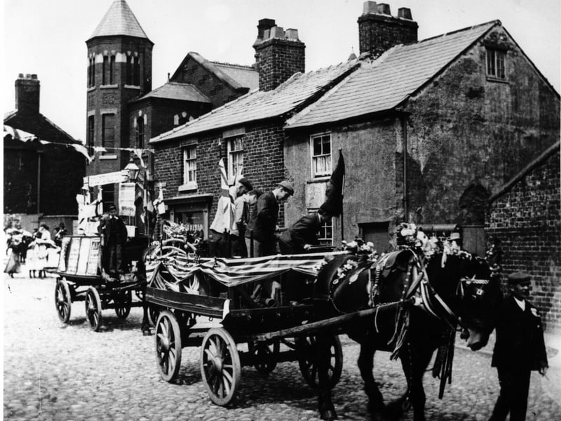 Poulton Whit Walk travels through Queen's Square into Higher Green passing the old Methodist Chapel at the corner of Chapel Street in the early 1900s