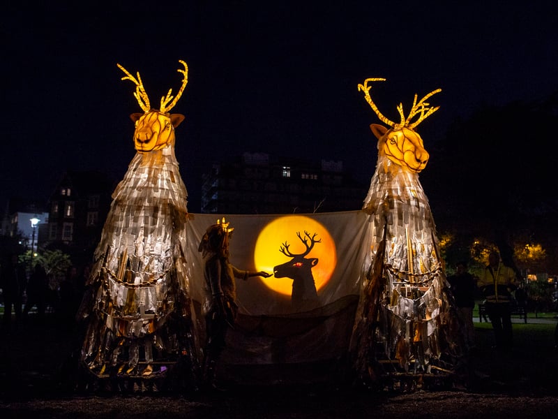 A stunning street performance, Ghost Caribou features giant illuminated creatures, part caribou, part spirit which roam a mystical world after dark. With music, song and shadow puppets they tell stories of lost homes, impossible migrations and seeds of hope.
