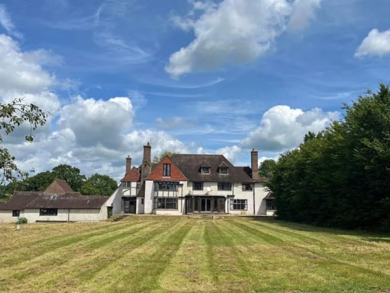 The listing says: "The property now offers the opportunity for refurbishment and repair to potentially create an impressive family house with extensive accommodation and combined with renovation of the mature grounds including potential reinstatement of the tennis court and swimming pool and enhancements of the nearby paddock and land."