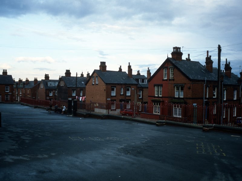 The playground of Quarry Mount Primary School looking towards Cross Quarry Street. Streets of terraced housing leading off are (from right) Bolland Street, Thomas Street, Quarry Place, Quarry Street and Christopher Road. Quarry Street continues on the far left while Cross Quarry Street becomes Glossop Street in the distance. Pictured in August 1985.