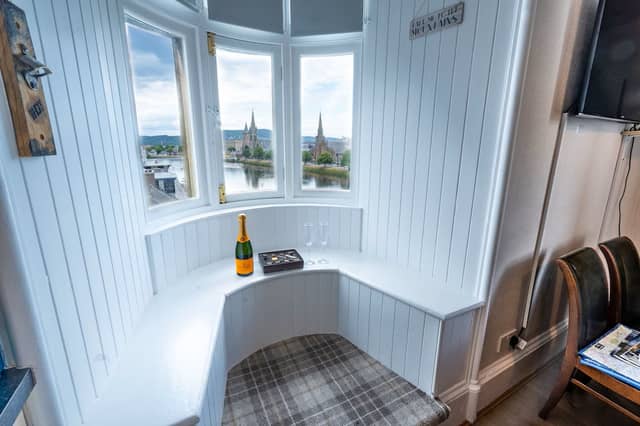 The Ness Walk Penthouse apartment features a unique window snug seat with incredible views across the city centre and attractions such as the River Ness and Inverness Castle.