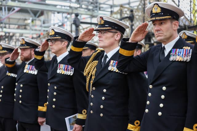 Pictured- Senior officers attending the Annual Trafalgar Day Ceremony at HMS Victory - as they hold a one minute salute.